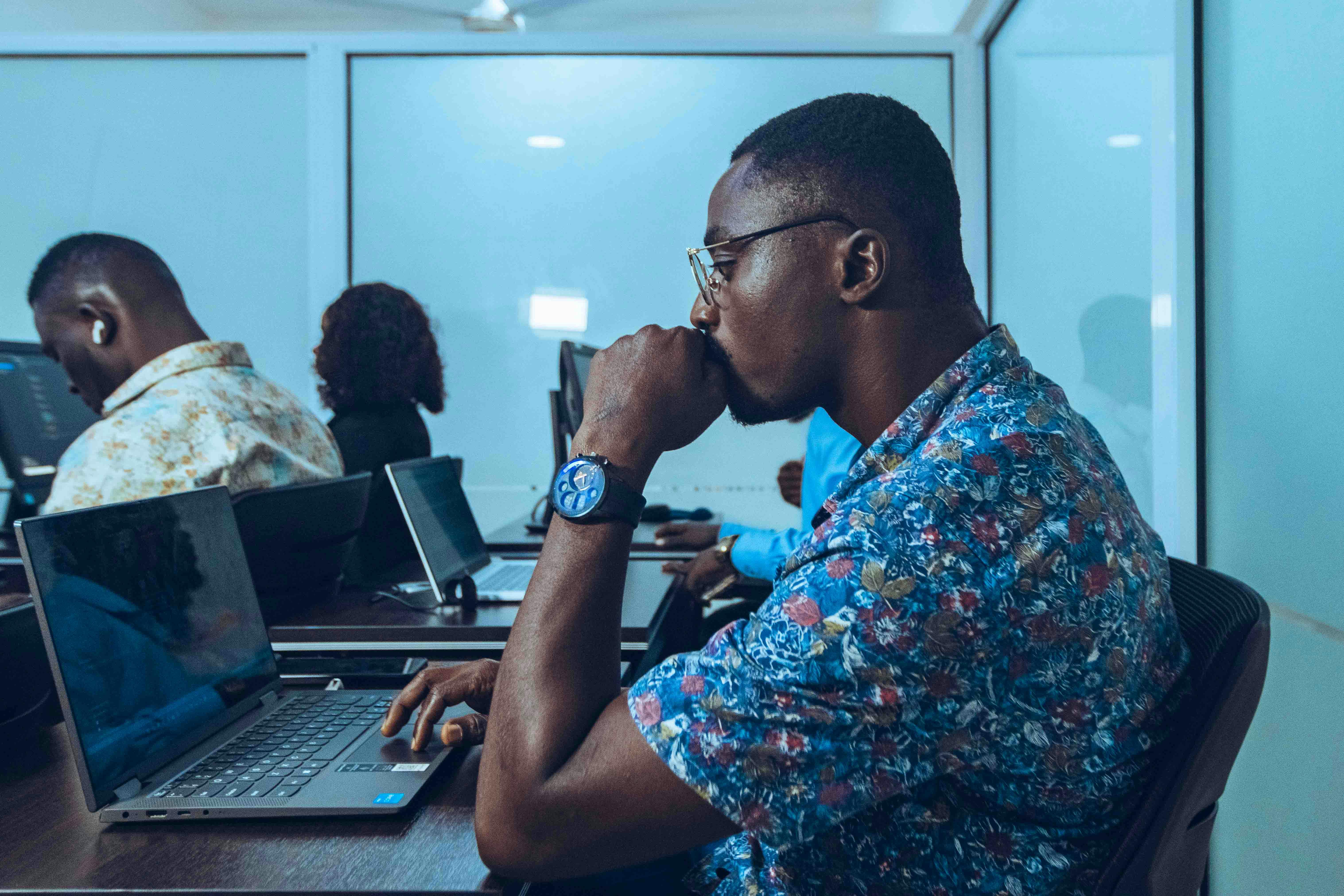 African students learning coding in a modern IT class